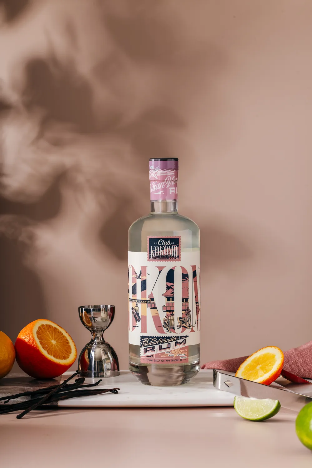 Club Kokomo Tahitian rum with citrus and a pink closure in dappled light